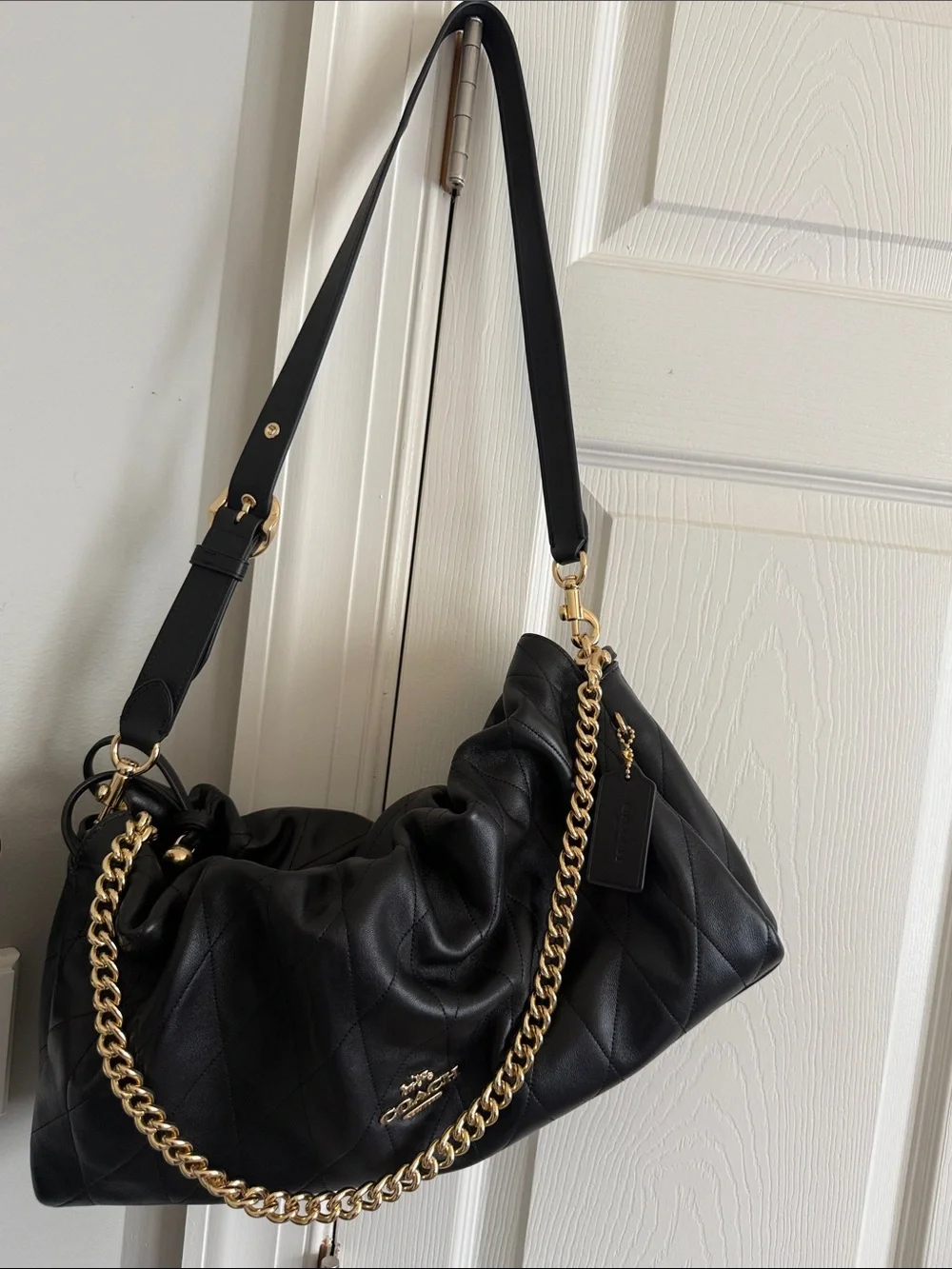 Coach Black Quilted Shoulder Bag with Gold Chain Accent